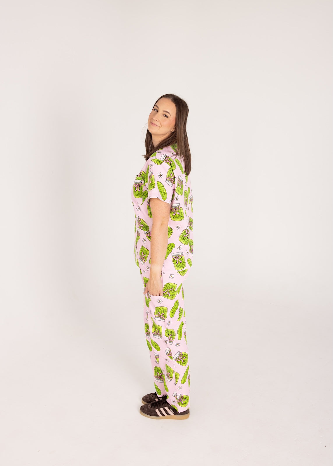 Person wearing pink fun scrubs with pickle pattern