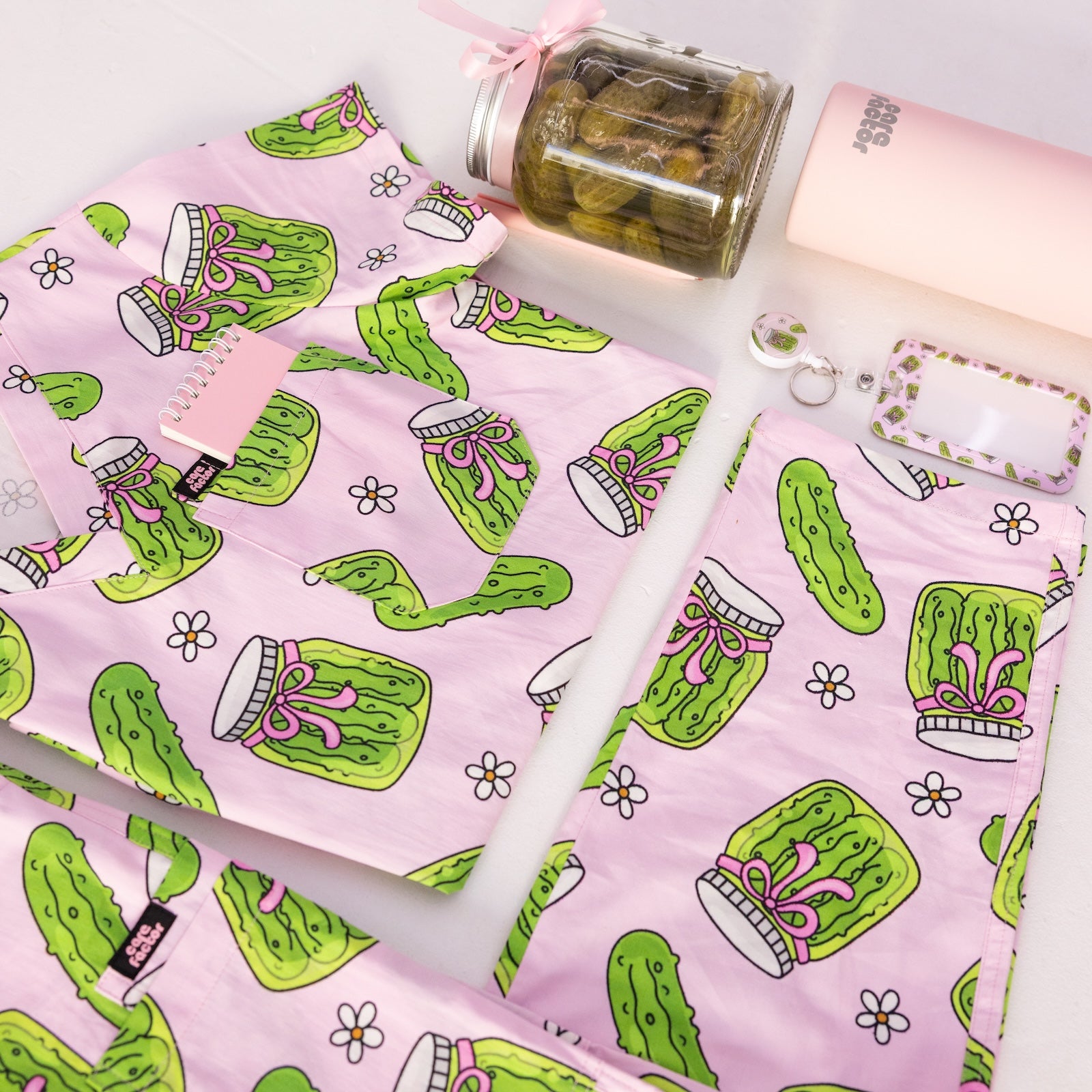 Person wearing pink fun scrubs with pickle pattern