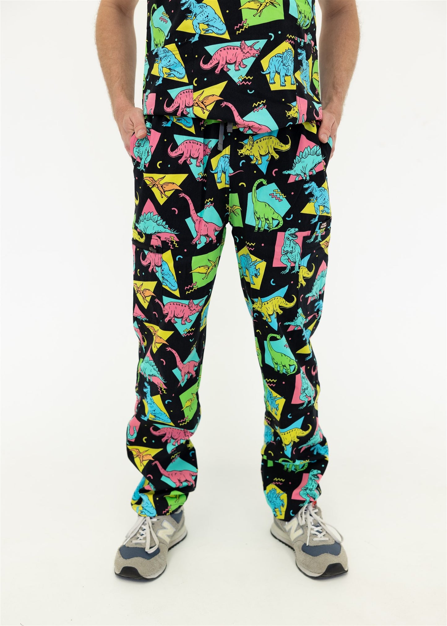 man in black and bright colour retro Dino scrub set pants