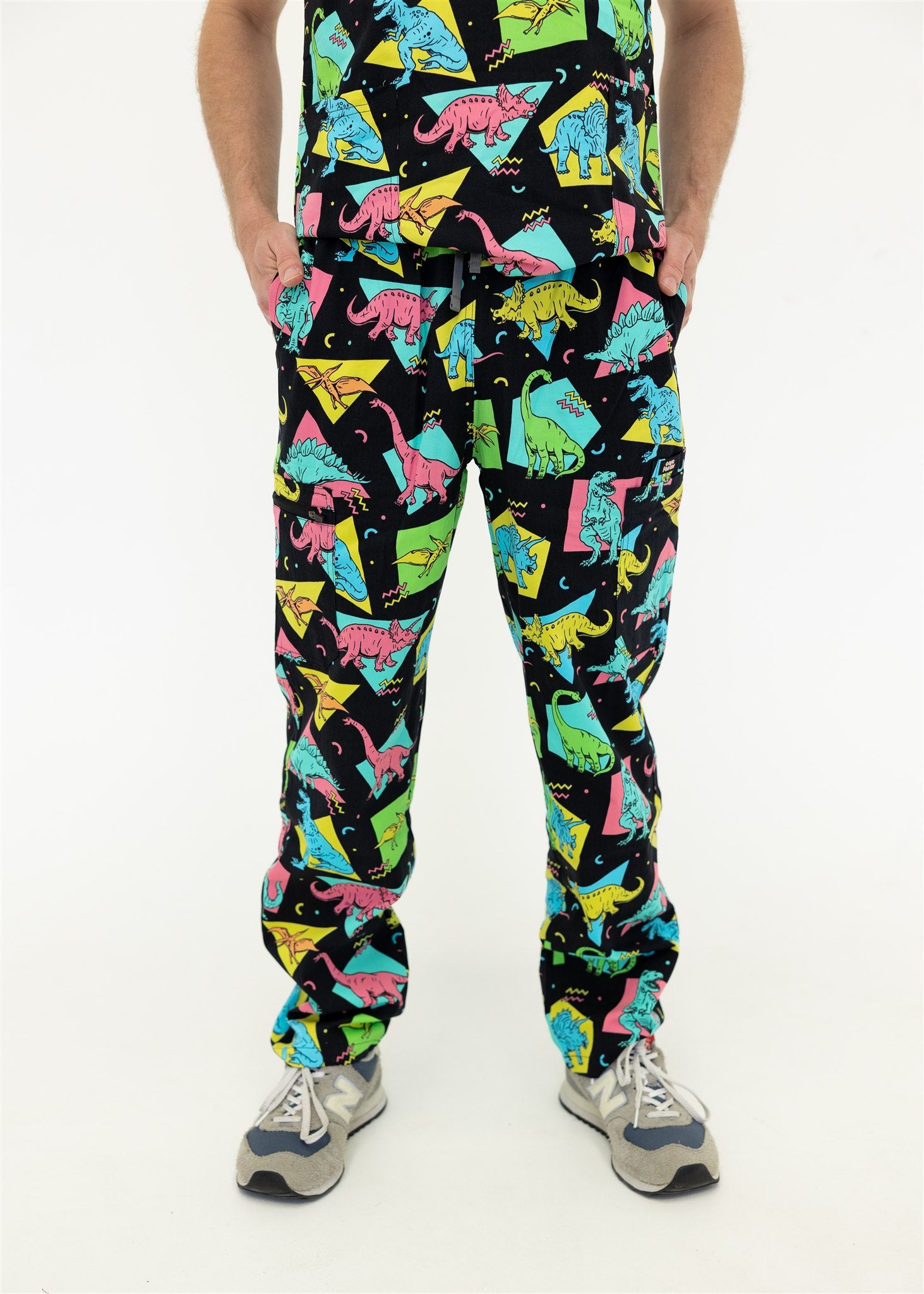 man in black and bright colour retro Dino scrub set pants