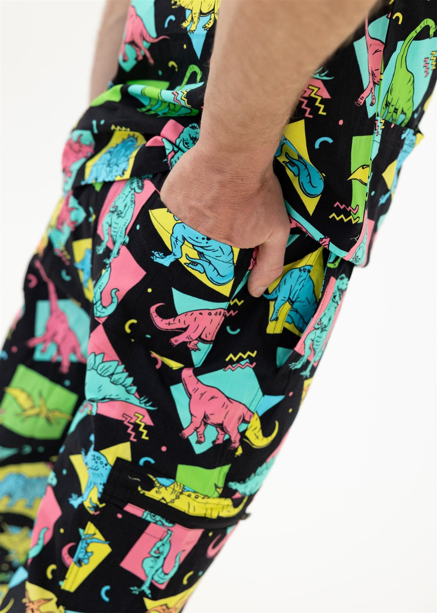 man in black and bright colour retro Dino scrub set pants