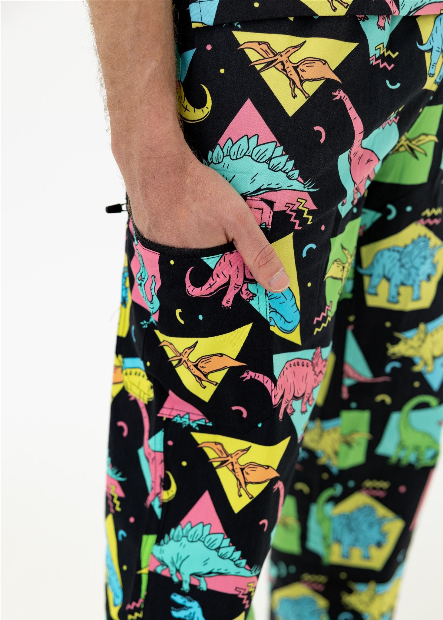 man in black and bright colour retro Dino scrub set pants