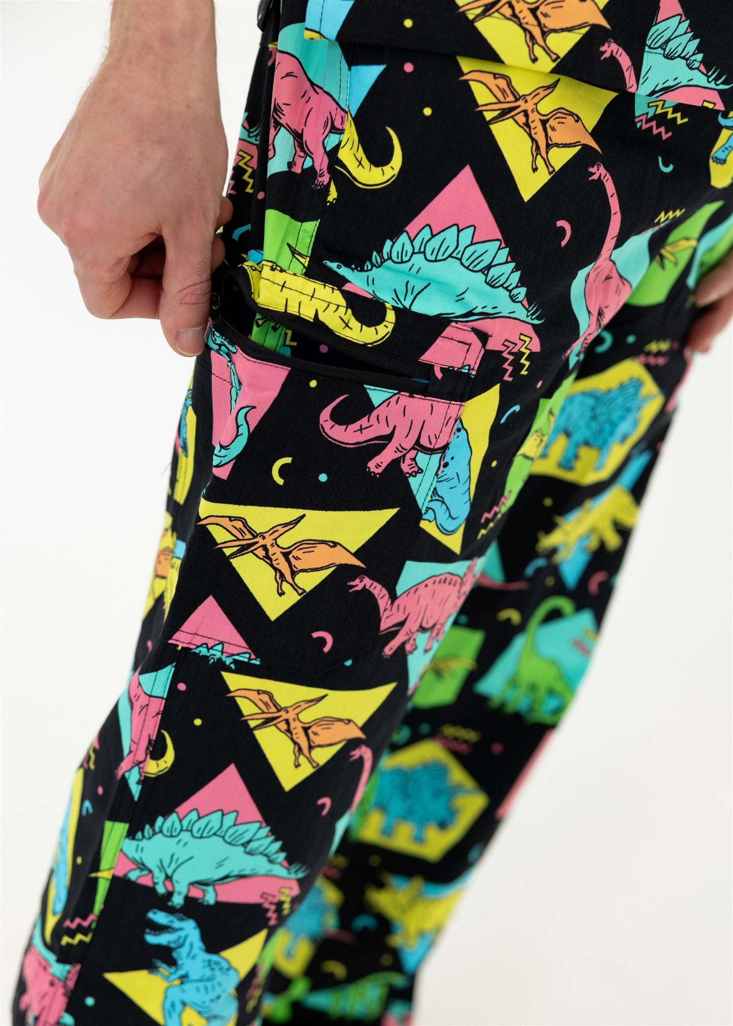 man in black and bright colour retro Dino scrub set pants