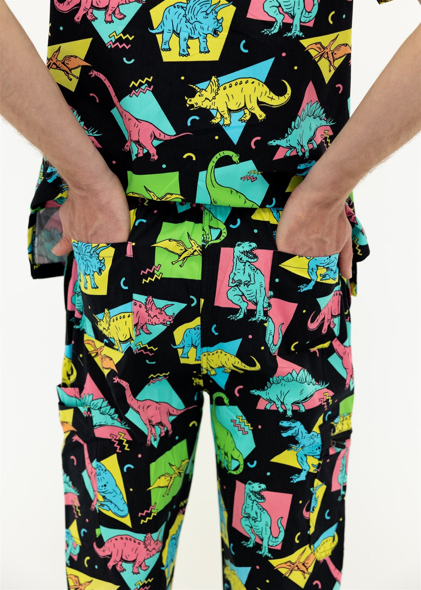 man in black and bright colour retro Dino scrub set pants