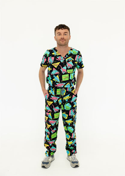 man in black and bright colour retro Dino scrub set