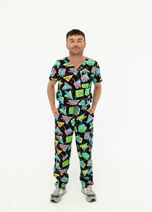 man in black and bright colour retro Dino scrub set