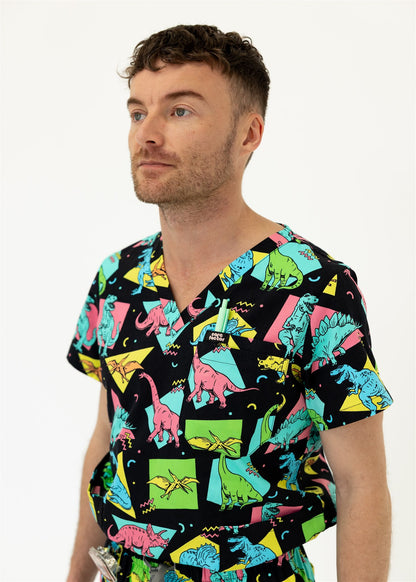 man in black and bright colour retro Dino scrub set