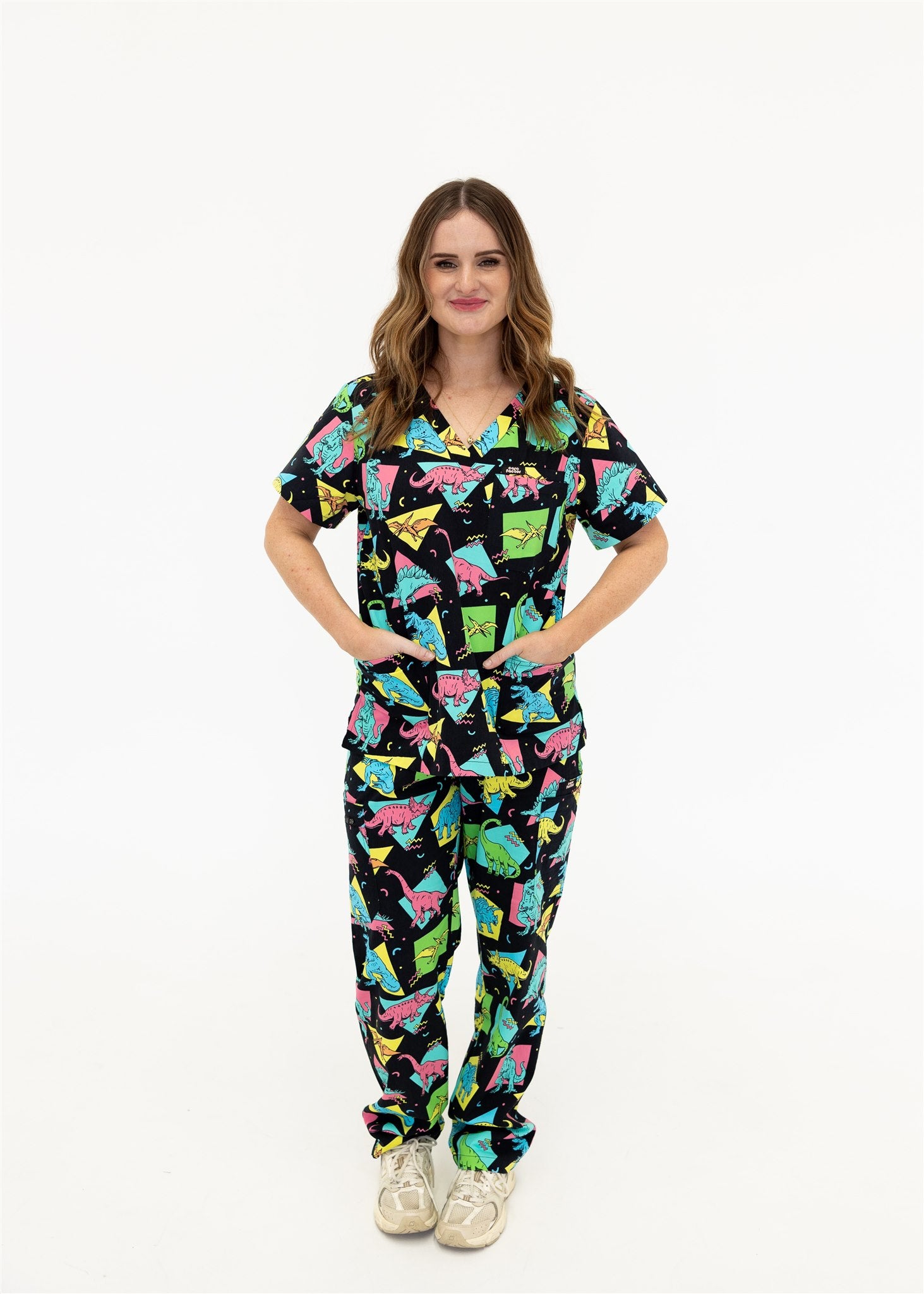 woman in black and bright colour retro Dino scrub set