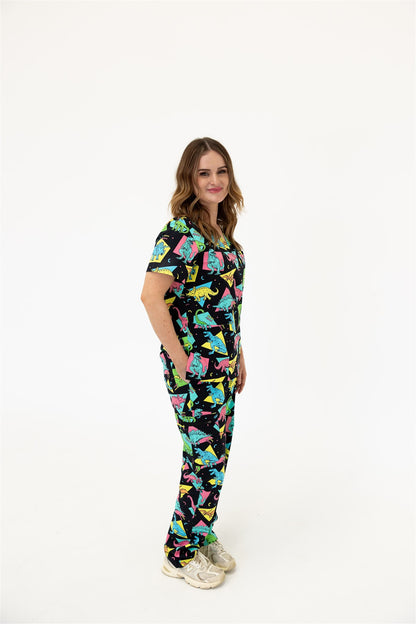 woman in black and bright colour retro Dino scrub set