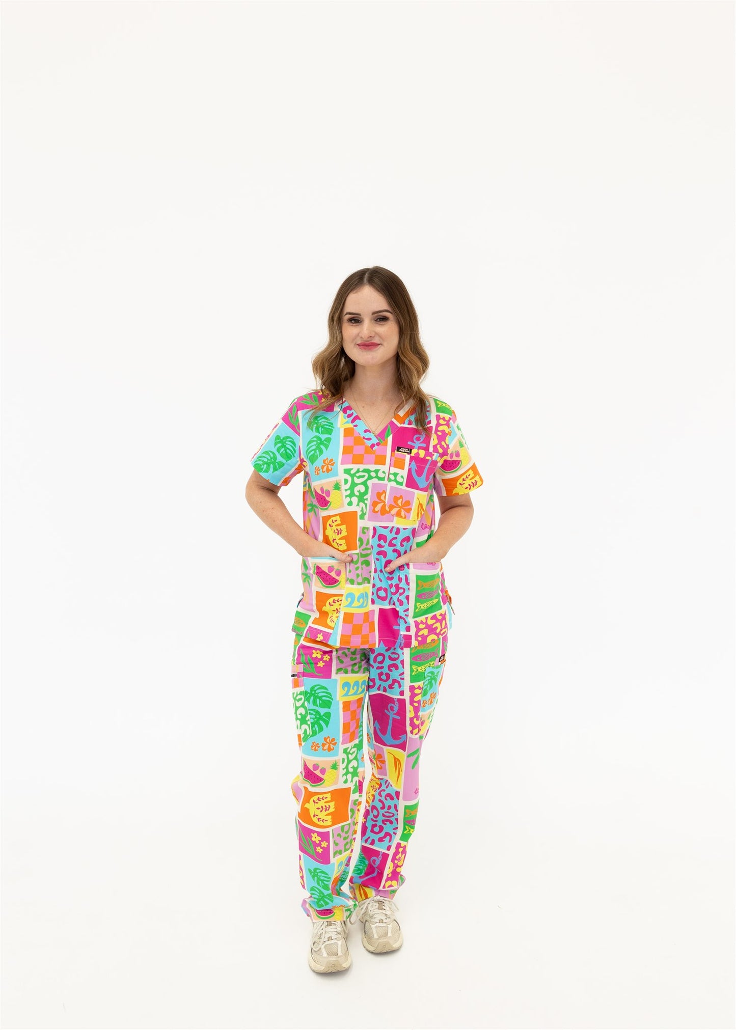 woman wearing a bright fun summery scrub set
