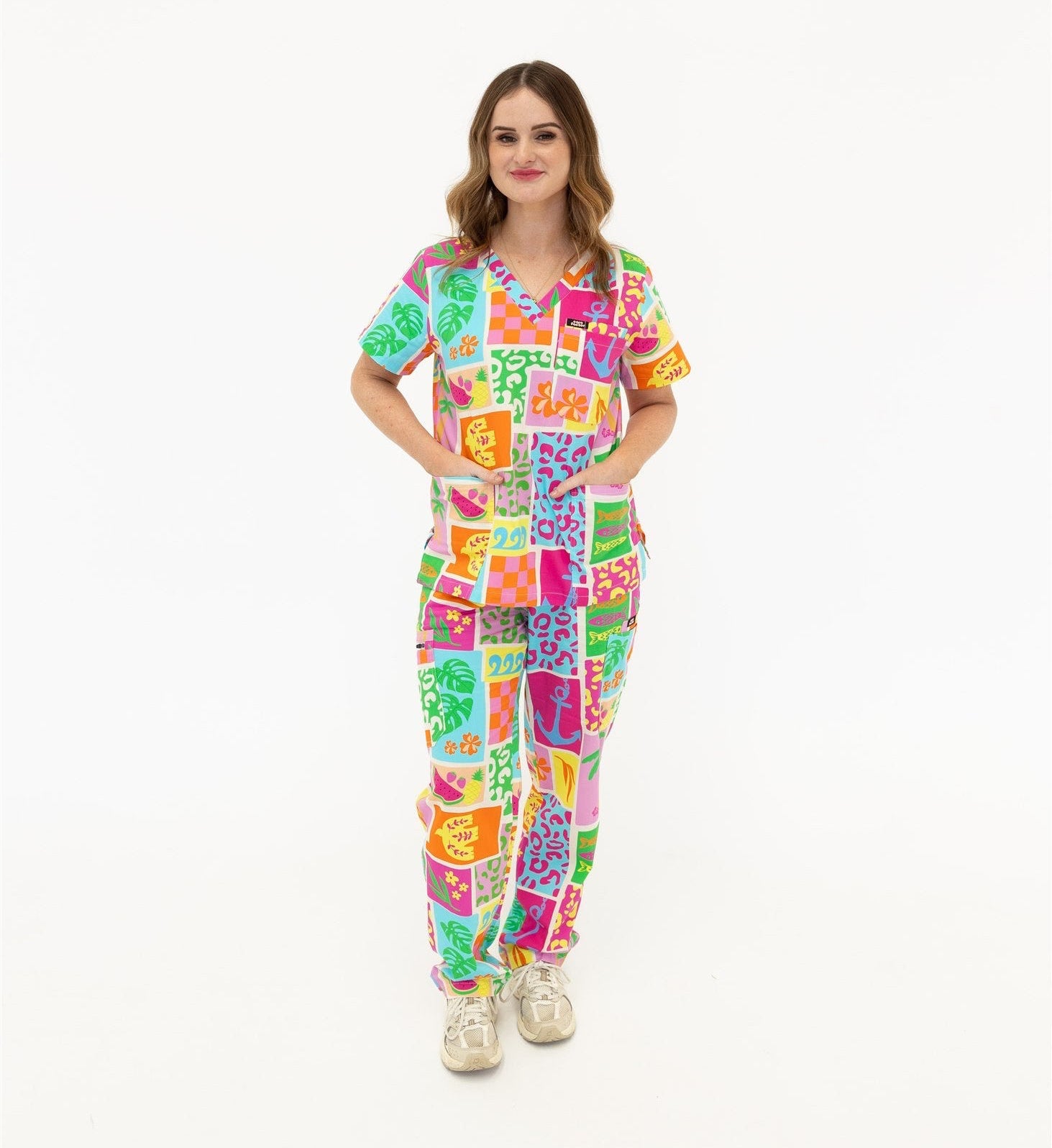 woman wearing a bright fun summery scrub set