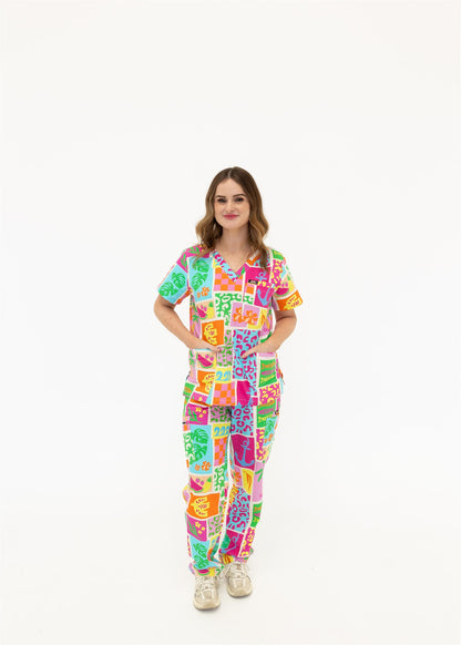 woman wearing a bright fun summery scrub set