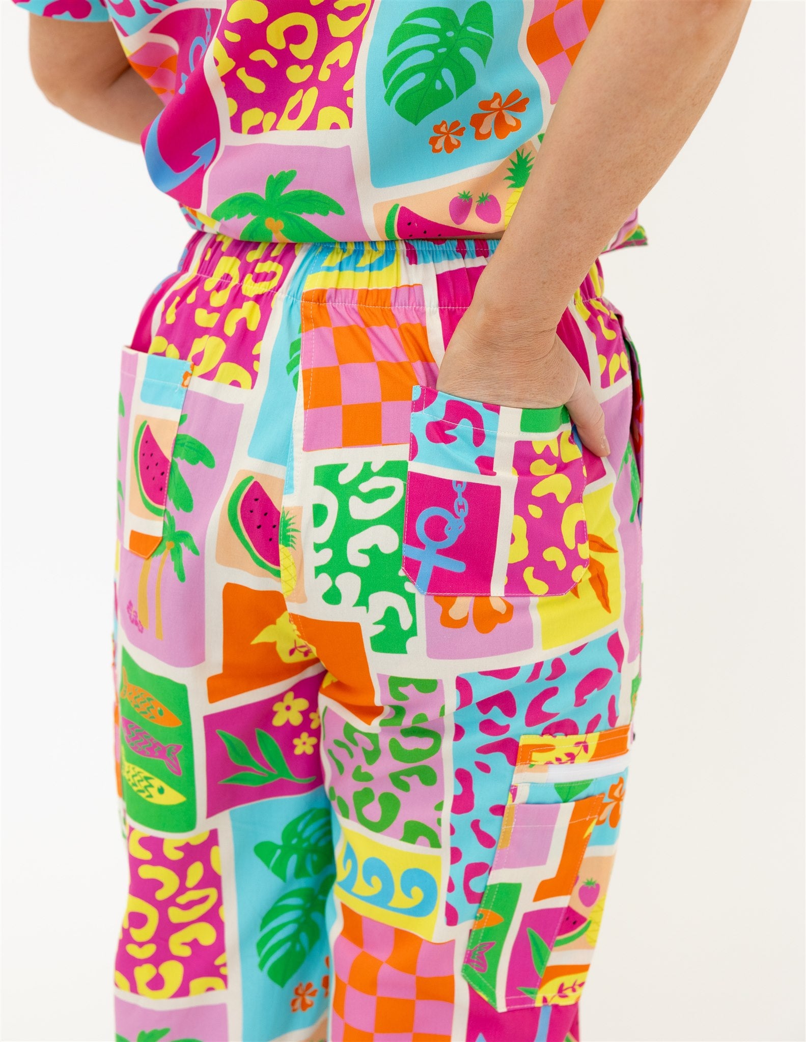 woman wearing a bright fun summery scrub set pants
