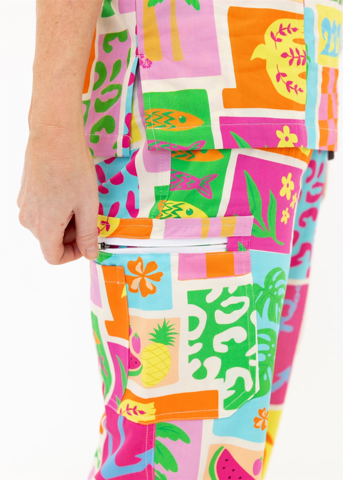 woman wearing a bright fun summery scrub set pants