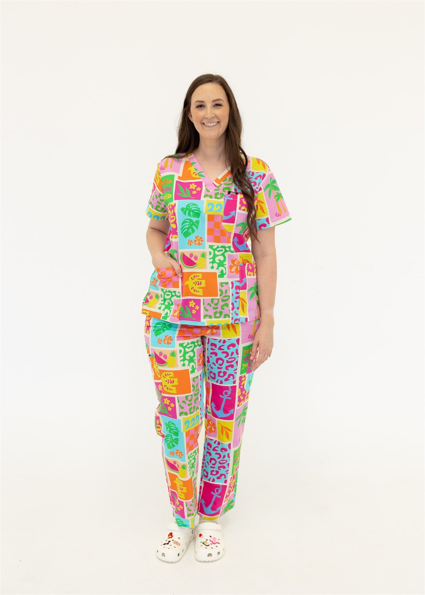 woman wearing a bright fun summery scrub set